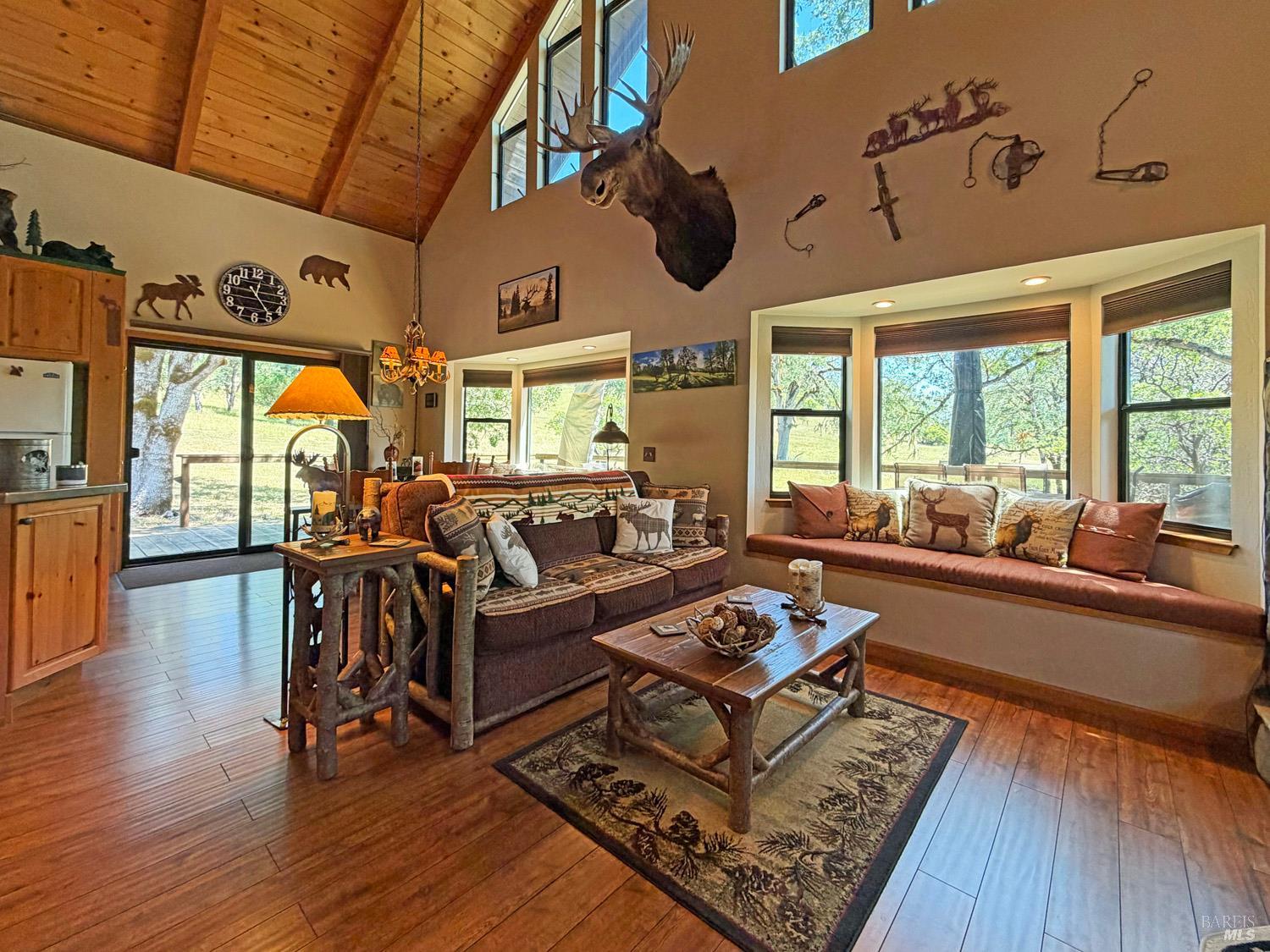 31312 High Point Road Potter Valley, CA 95469 - Photo 11 of 58 a living room with lots of furniture and a large window