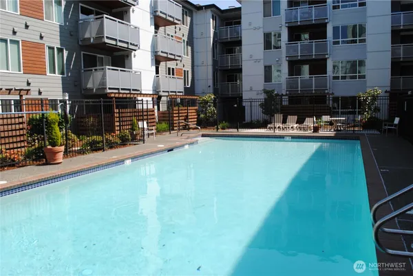 a view of swimming pool with outdoor seating