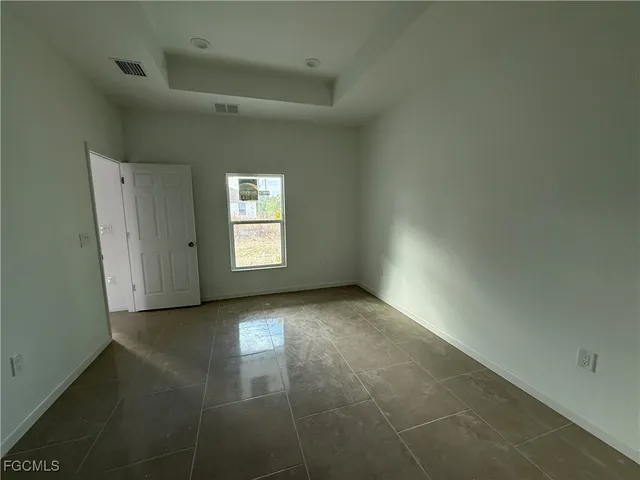a view of a hallway with a window