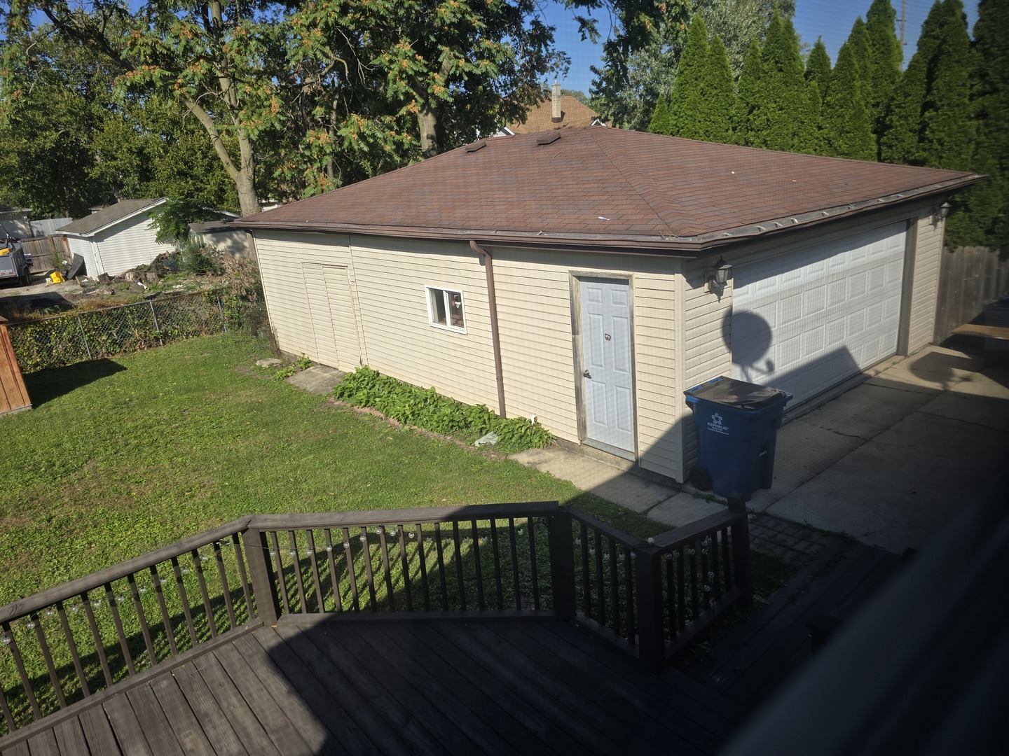 3618 148th Street Midlothian, IL 60445 - Photo 21 of 22 a aerial view of a house with table and chairs under an umbrella