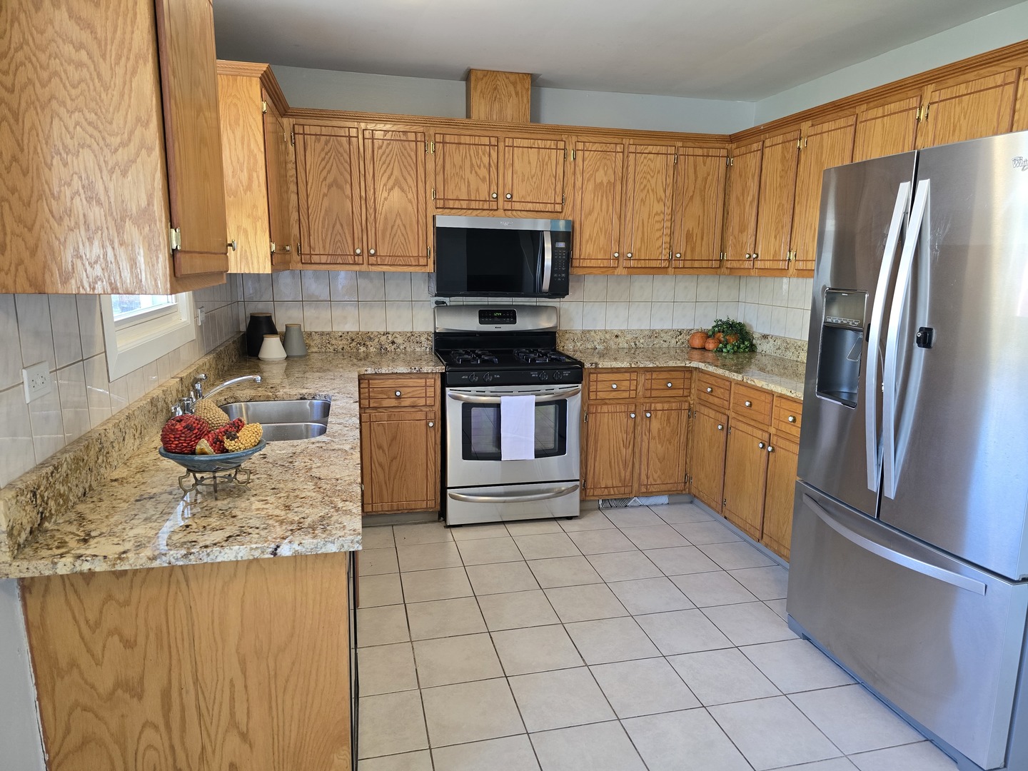 3618 148th Street Midlothian, IL 60445 - Photo 5 of 22 a kitchen with stainless steel appliances granite countertop a refrigerator sink and stove