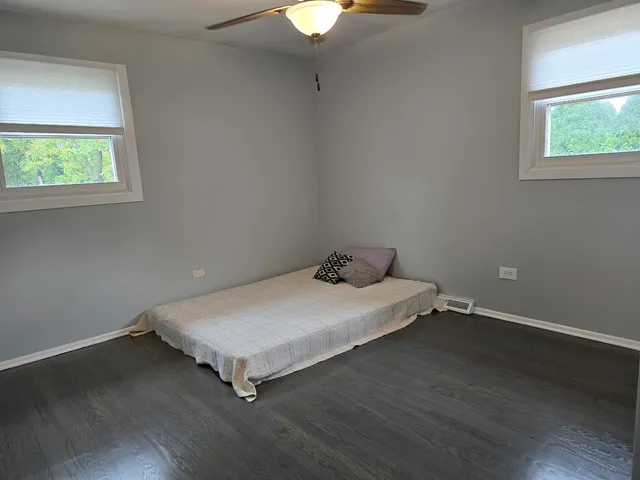 a room with a bed and a window