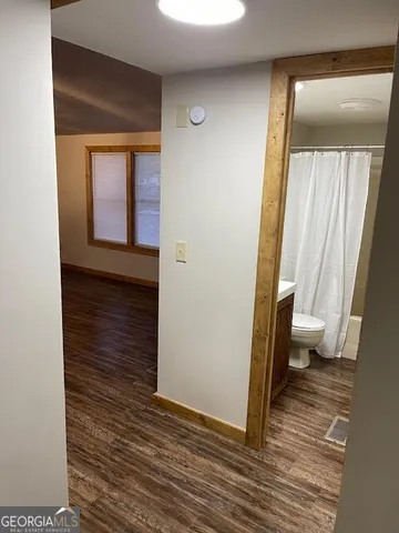 a view of a bathroom from a hallway
