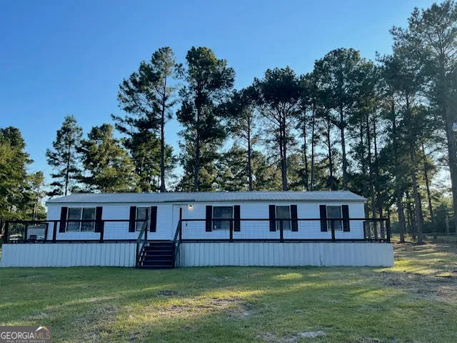 a view of a house with a garden