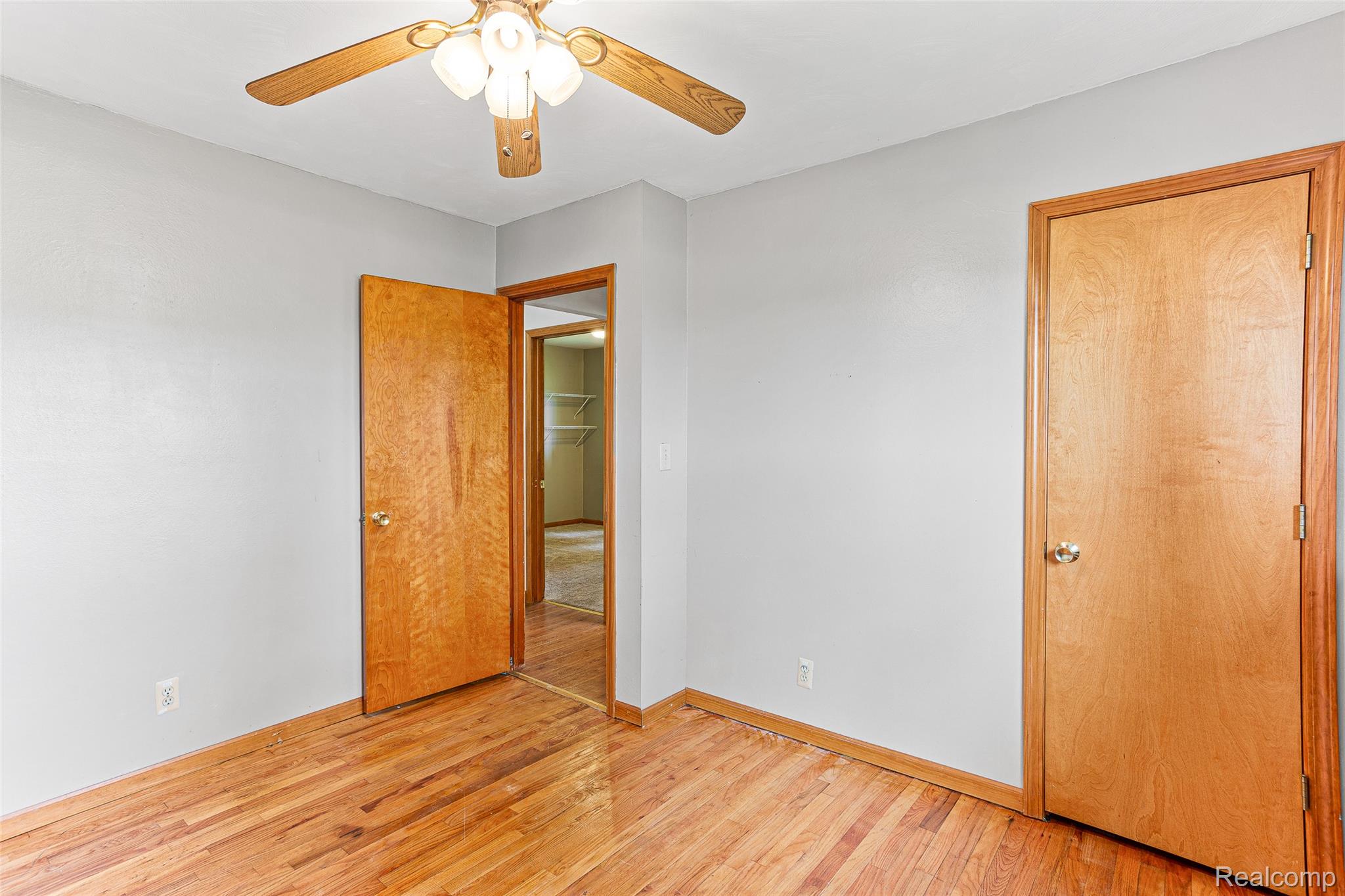9561 Exeter Road Carleton, MI 48117 - Photo 25 of 46 Wood-finish flooring, ceiling fan with integrated lighting, wood-finish interior doors