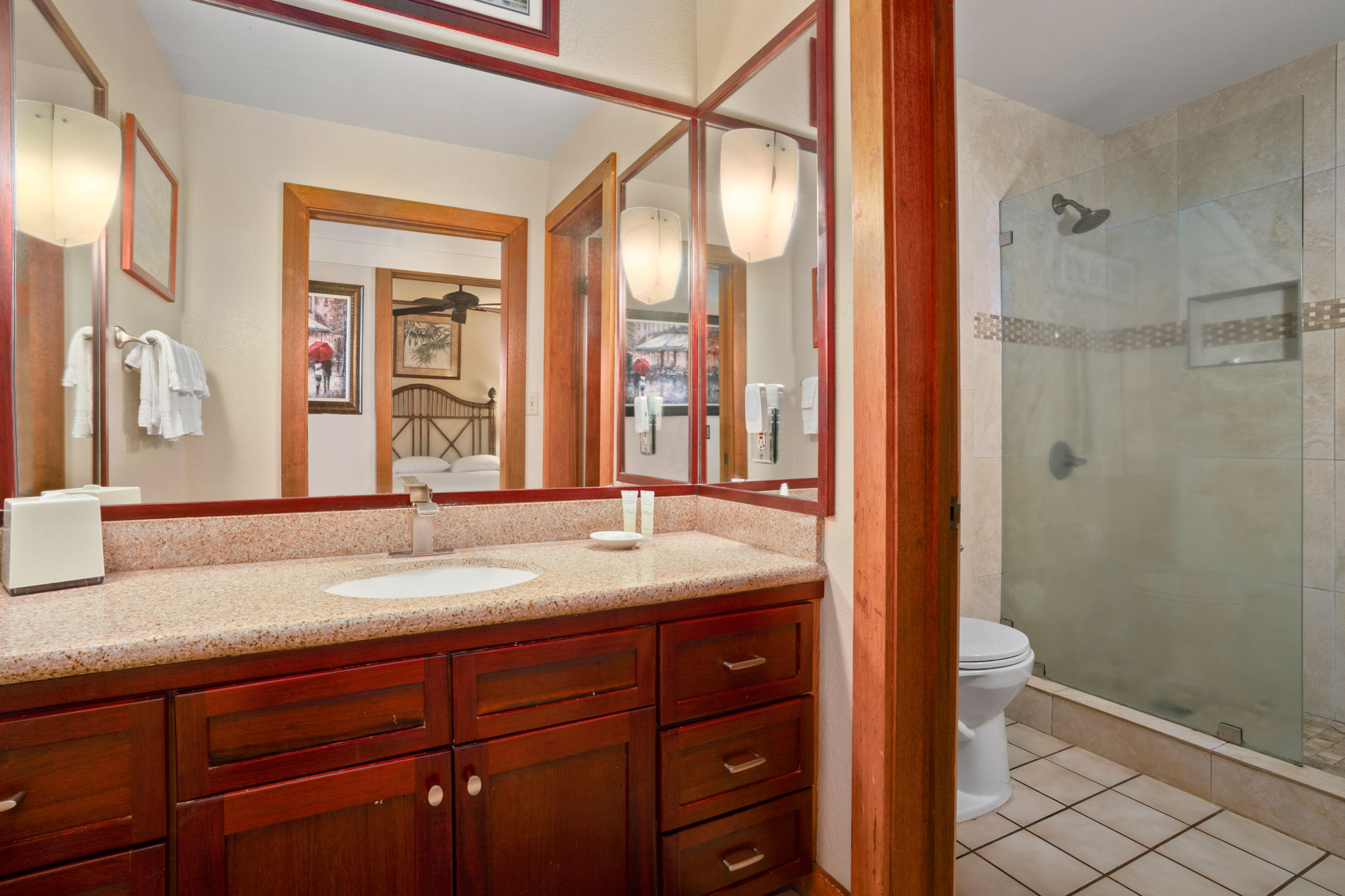 2253 Poipu Road, Unit 330 Koloa, HI 96756 - Photo 16 of 26 a bathroom with a granite countertop sink toilet and shower