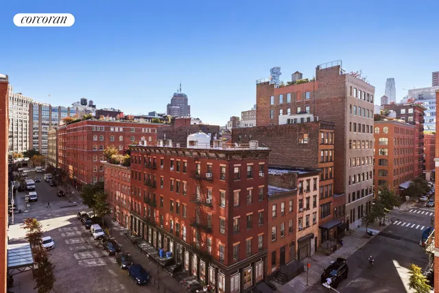 a living room with furniture a large window and a flat screen tv