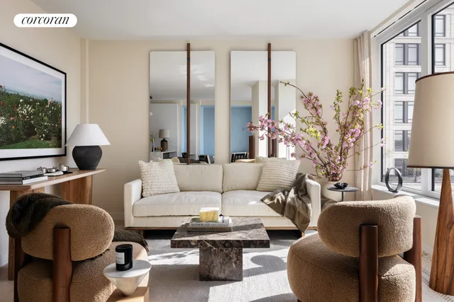 a living room with furniture a rug and a window