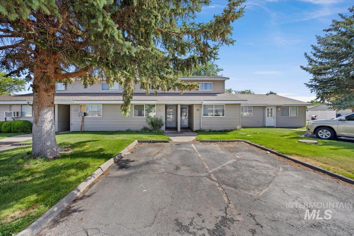 259 Pheasant Road, Unit 84 Twin Falls, ID 83301 - Photo 2 of 25 Multi-unit residential building featuring light-colored siding and individual entryways