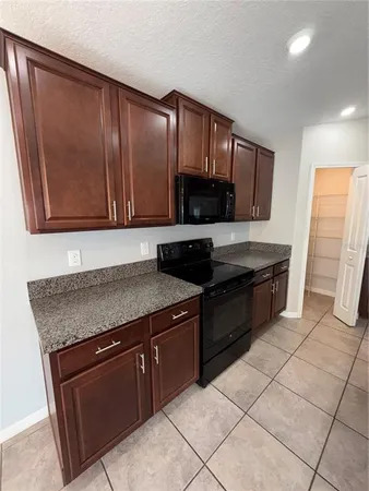 an empty room with wooden floor and closet