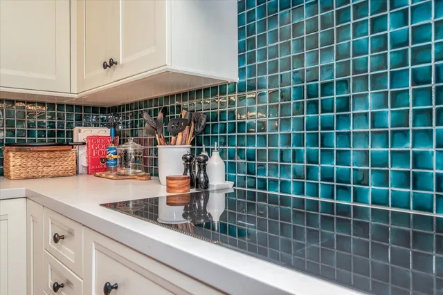 a bathroom with a sink a mirror and shower