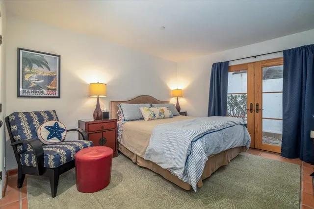 a bedroom with bed and window