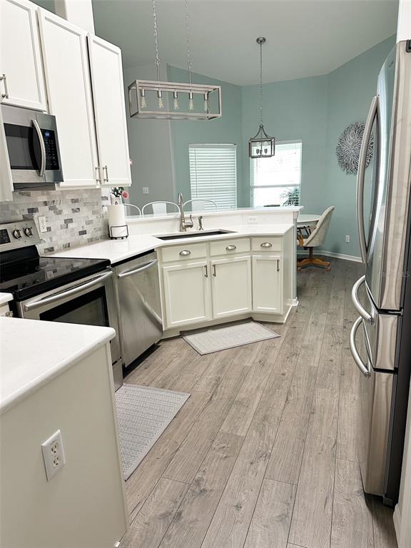 33632 Wesley Road Eustis, FL 32736 - Photo 11 of 34 a kitchen with a sink appliances and cabinets
