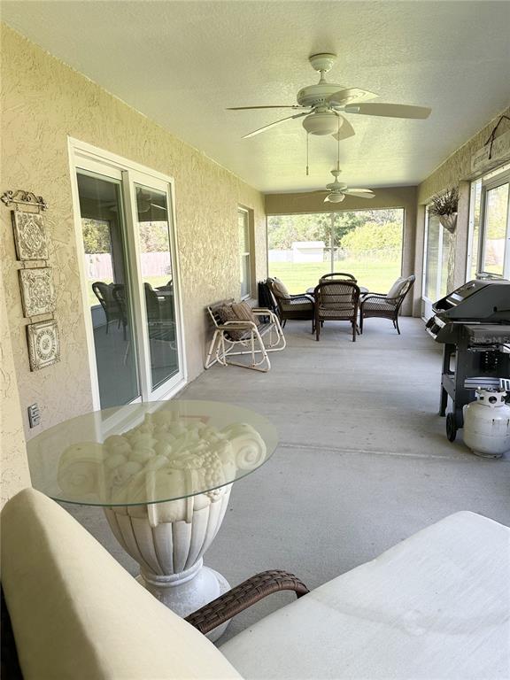33632 Wesley Road Eustis, FL 32736 - Photo 14 of 34 a view of a dining room with furniture window and outside view