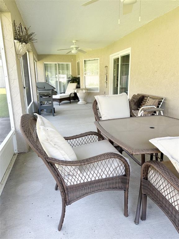 33632 Wesley Road Eustis, FL 32736 - Photo 15 of 34 a living room with furniture and a table