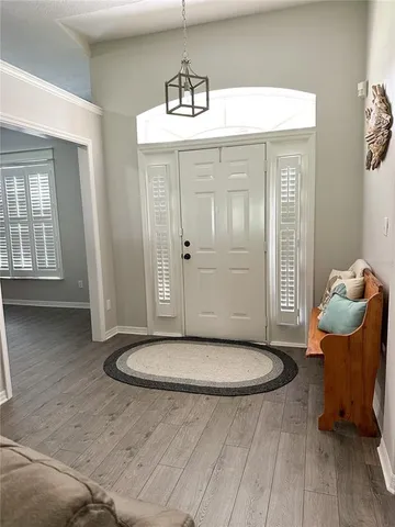 a view of a livingroom with furniture and a window