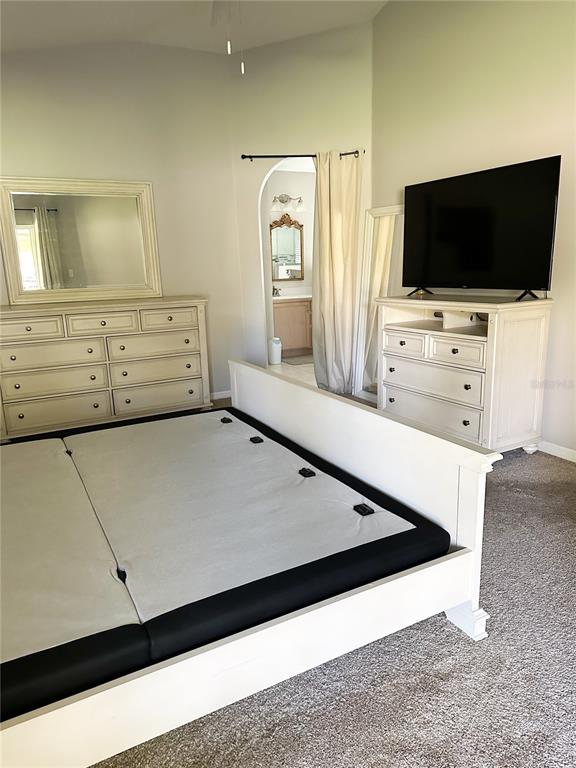 33632 Wesley Road Eustis, FL 32736 - Photo 19 of 34 a living room with flat screen tv