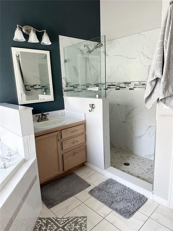 33632 Wesley Road Eustis, FL 32736 - Photo 22 of 34 a bathroom with a sink a toilet and shower