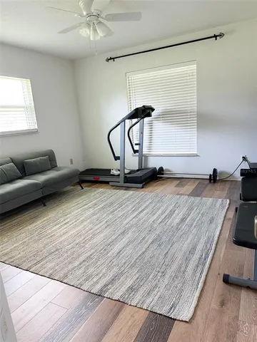 a room with gym equipment and a window