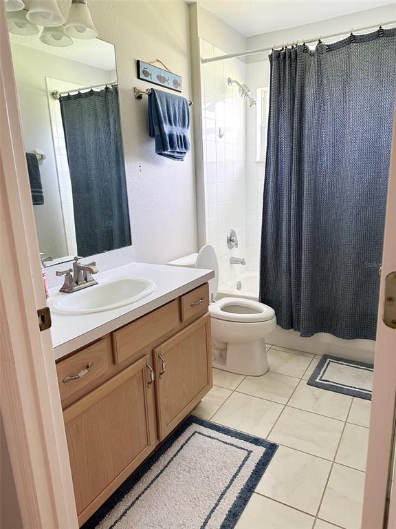 33632 Wesley Road Eustis, FL 32736 - Photo 31 of 34 a bathroom with a sink a toilet and shower