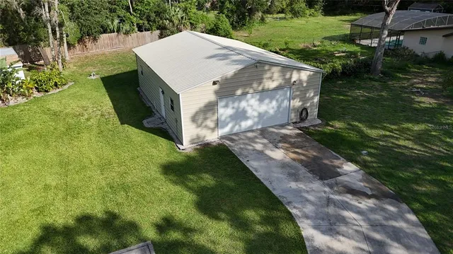 a view of a back yard of the house