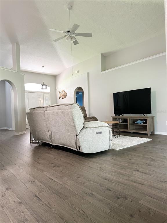 33632 Wesley Road Eustis, FL 32736 - Photo 7 of 34 a living room with furniture and a flat screen tv