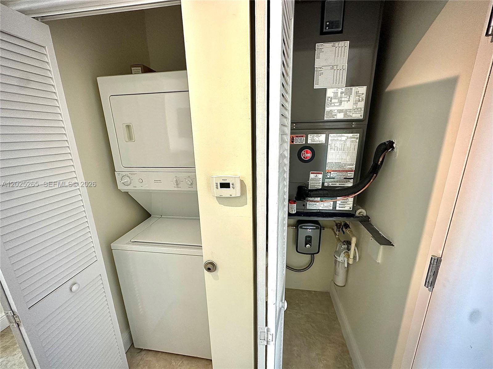 2525 Southwest 3rd Avenue, Unit 705 Miami, FL 33129 - Photo 8 of 26 a utility room with dryer and washer