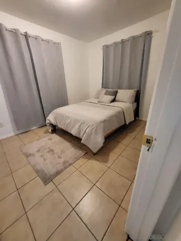 a kitchen with granite countertop a sink a counter space and appliances