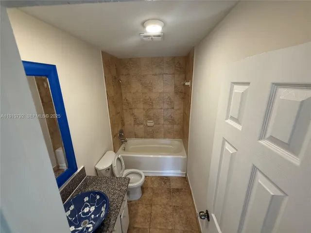 a bathroom with a toilet and a sink