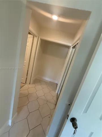 a view of a room with white walls