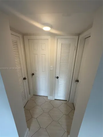 a view of a fountain in front of a house