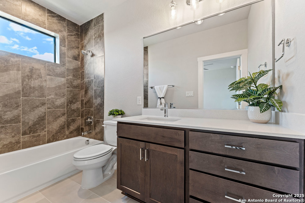 7946 Kennedy Hill Drive San Antonio, TX 78235 - Photo 20 of 35 a bathroom with a sink a toilet and a bathtub