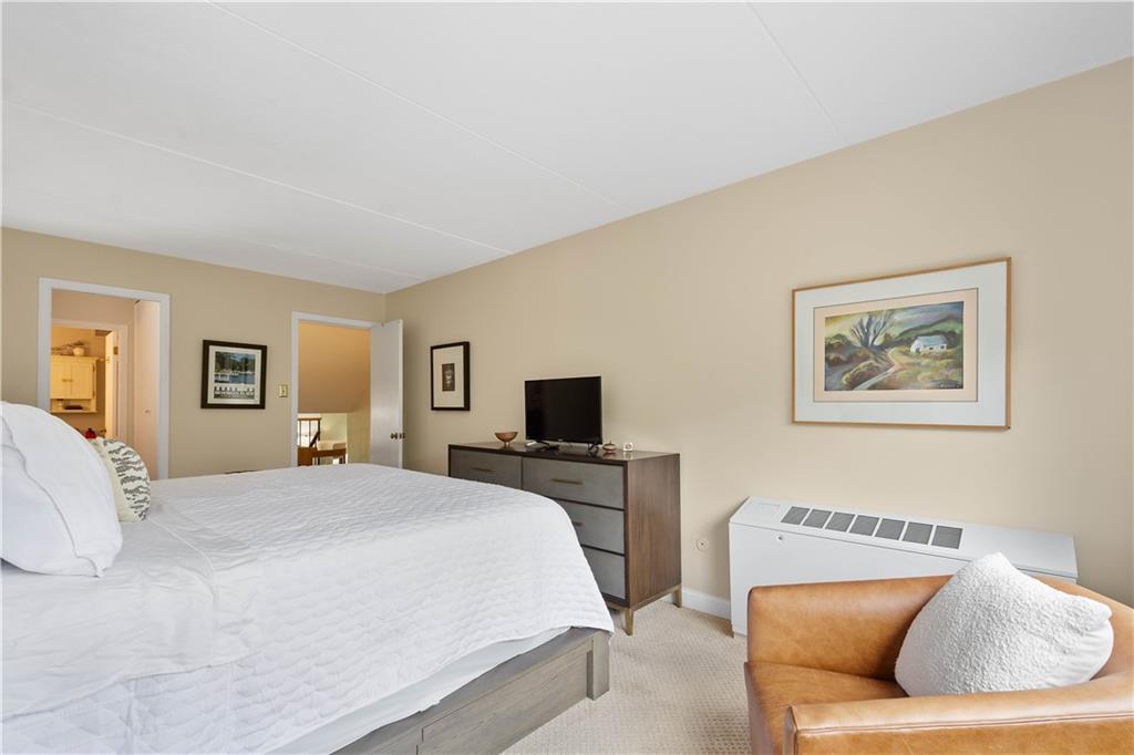 1150 Bower Hill Road, Unit 514B Pittsburgh, PA 15243 - Photo 24 of 44 a bedroom with a large bed and a couch