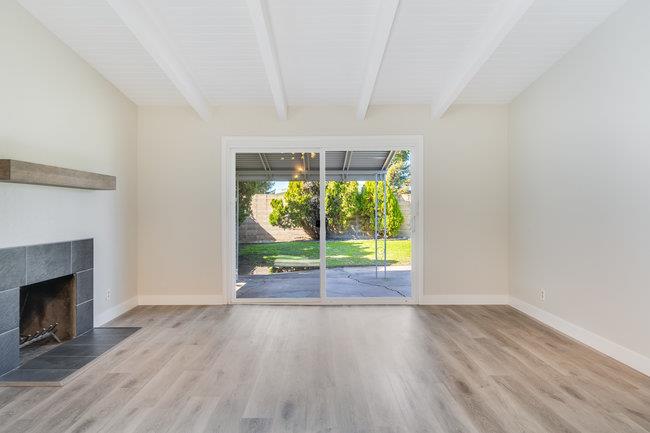 28207 Rochelle Avenue Hayward, CA 94544 - Photo 11 of 27 a view of empty room with wooden floor and fireplace
