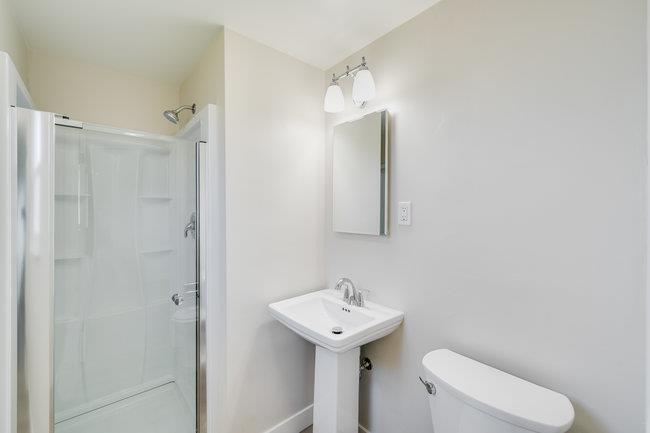 28207 Rochelle Avenue Hayward, CA 94544 - Photo 15 of 27 a bathroom with a sink a toilet and shower
