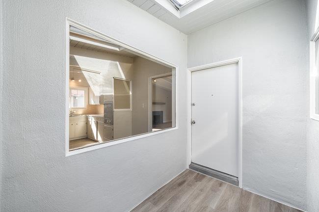 28207 Rochelle Avenue Hayward, CA 94544 - Photo 6 of 27 a view of an empty room with wooden floor and a window