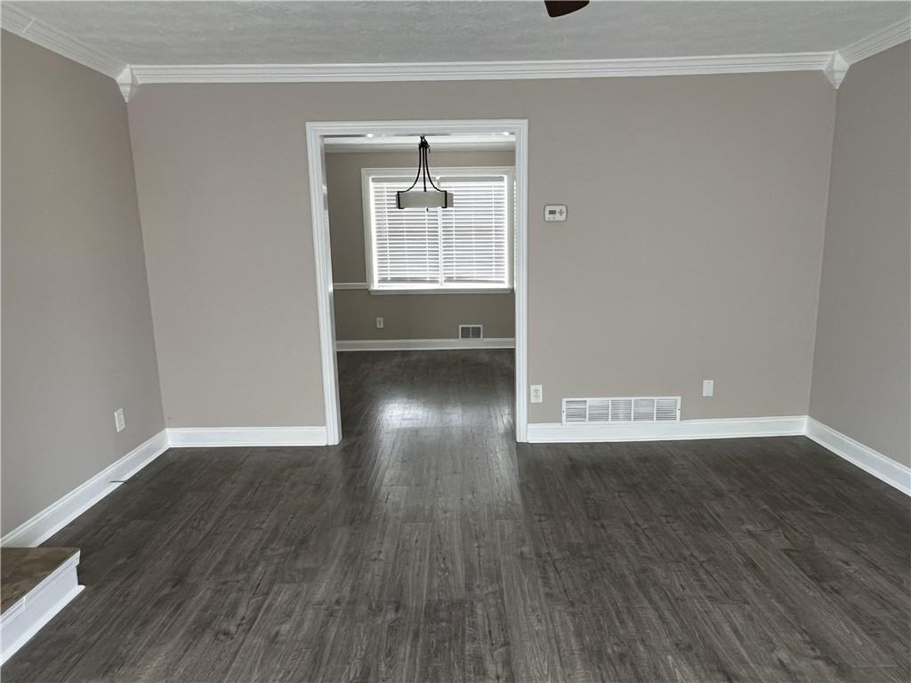 893 Sandune Drive Norcross, GA 30093 - Photo 11 of 14 a view of an empty room with wooden floor and a window