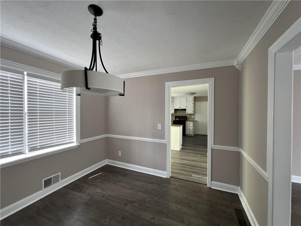 893 Sandune Drive Norcross, GA 30093 - Photo 12 of 14 a view of empty room with wooden floor and fan