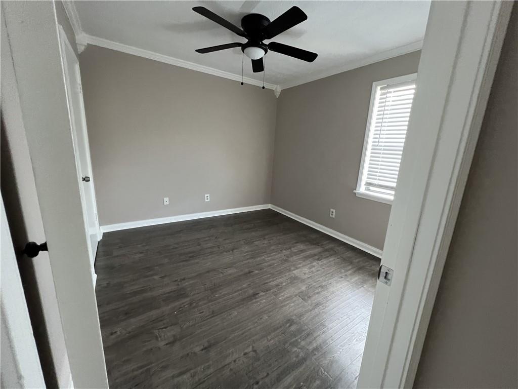 893 Sandune Drive Norcross, GA 30093 - Photo 6 of 14 a view of a room with wooden floor and a ceiling fan