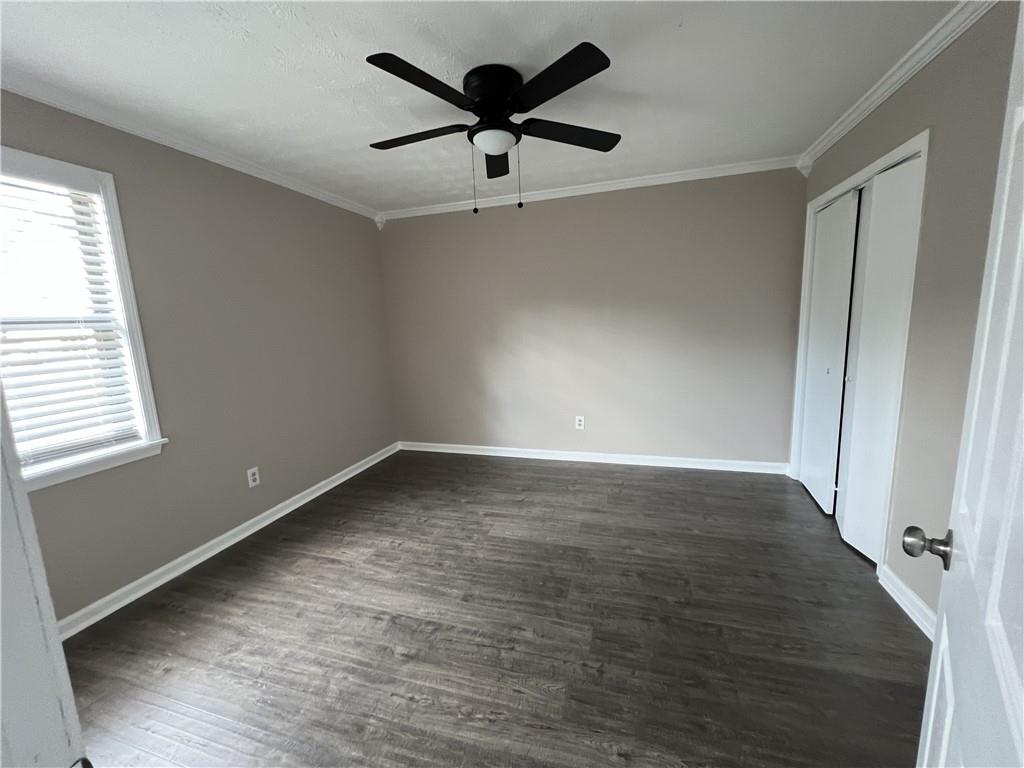 893 Sandune Drive Norcross, GA 30093 - Photo 7 of 14 wooden floor in an empty room with a window