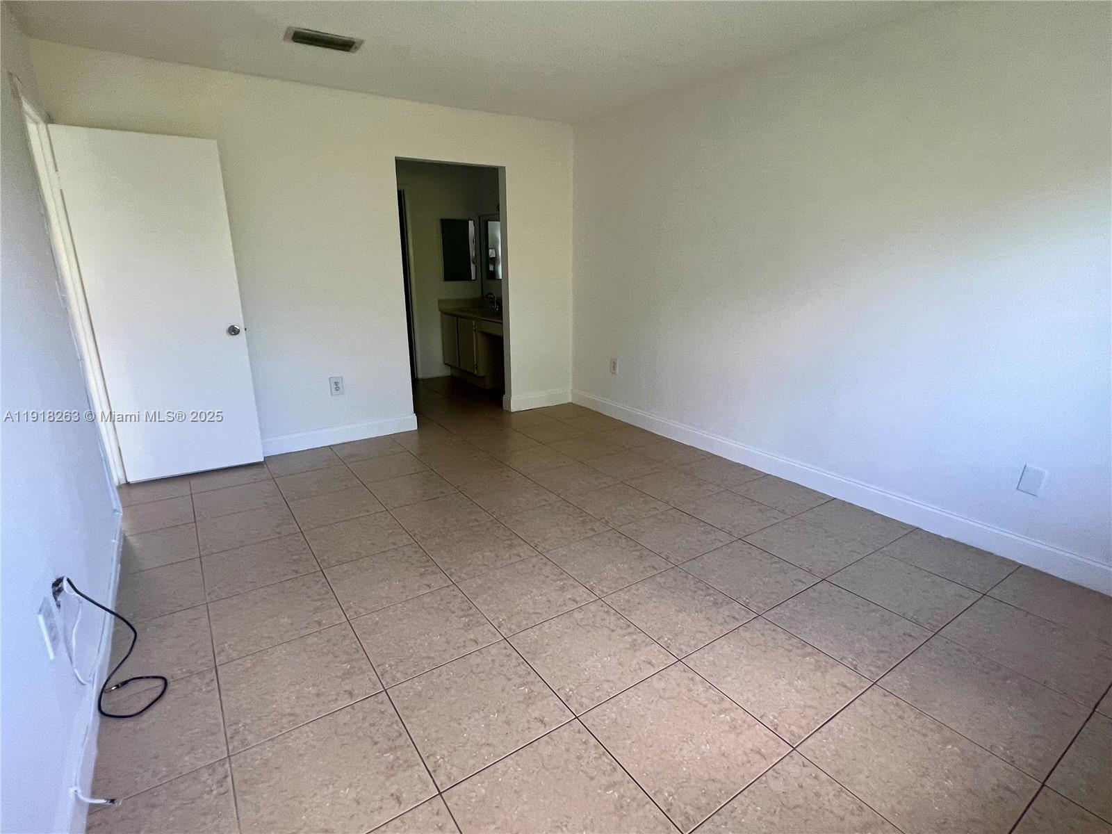 9961 Northwest 9th St Circle, Unit 818 Miami, FL 33172 - Photo 15 of 25 a view of an empty room and closet