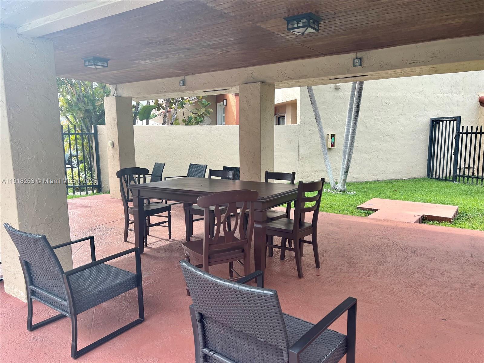 9961 Northwest 9th St Circle, Unit 818 Miami, FL 33172 - Photo 25 of 25 a view of a dining room with furniture window and outside view