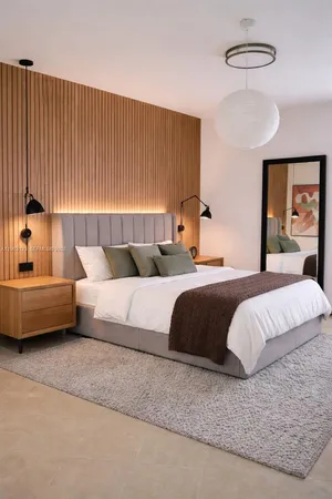 a bedroom with a bed and a couch