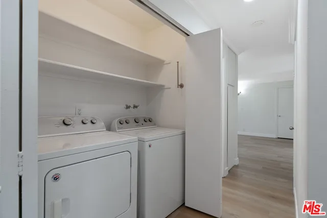 a view of storage and utility room with washer and dryer