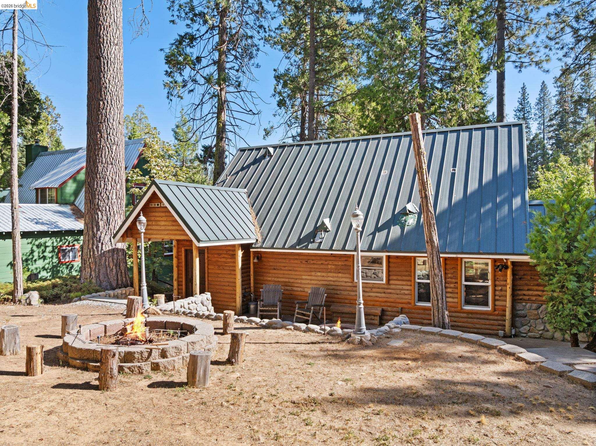 25972 Long Barn Road Long Barn, CA 95335 - Photo 28 of 36 large back yard offers cement patio off the back door with steps leading up to expansive level area for playing and enjoying the peaceful surroundings.
