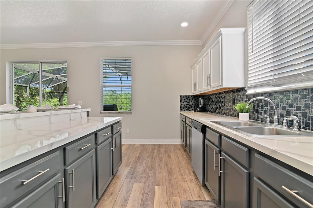 701 Kettering Road Davenport, FL 33897 - Photo 12 of 41 a kitchen with a sink and large window
