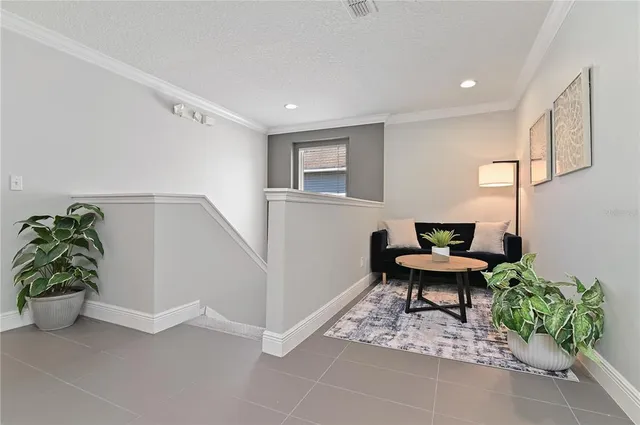 a workspace with furniture and a potted plant
