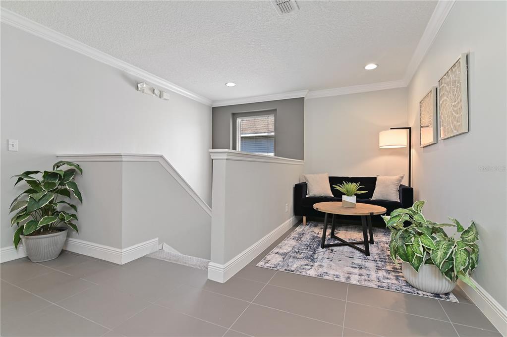 701 Kettering Road Davenport, FL 33897 - Photo 15 of 41 a workspace with furniture and a potted plant