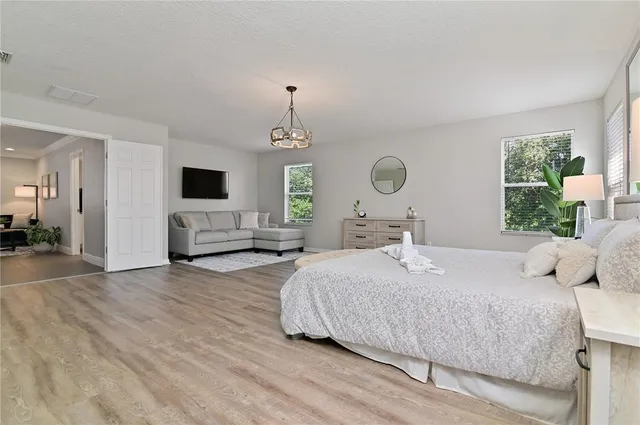 a bedroom with a bed and window