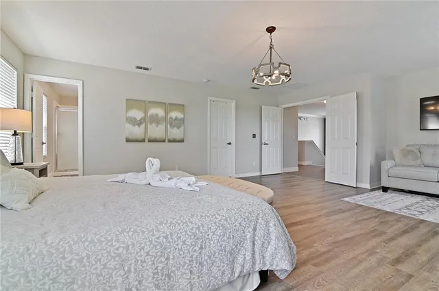 a bedroom with a bed and a couch